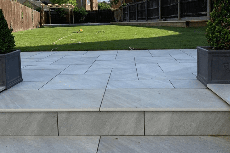 Garden clearance installation of cotswold paving landscaping patio design 8