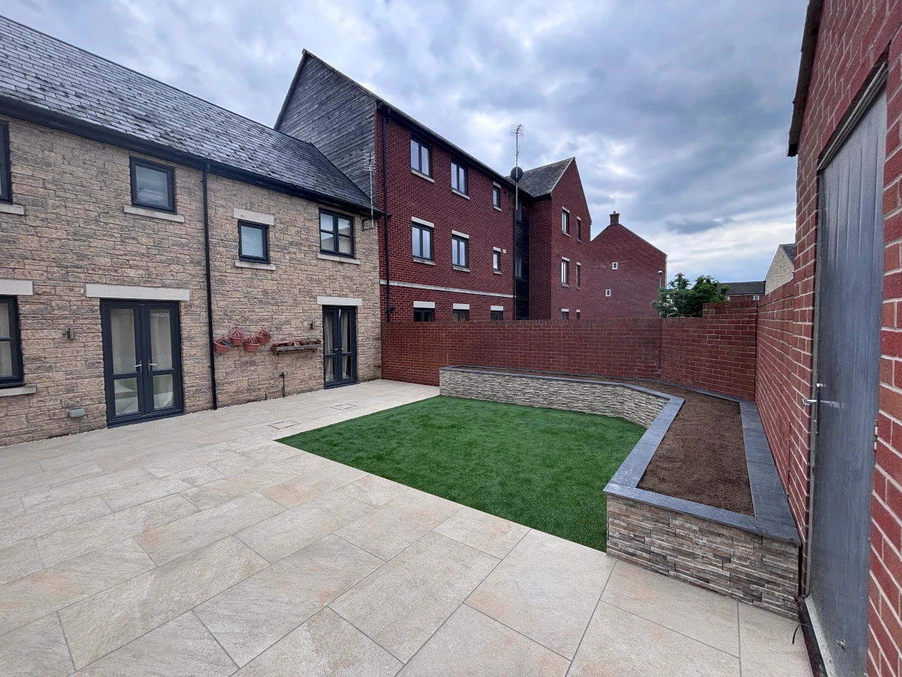 Garden clearance installation of cotswold paving landscaping patio design 1